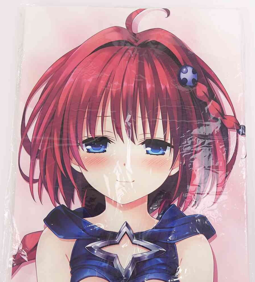 Portrait of an anime girl with pink-red hair, blue eyes, and a blue star-emblem outfit, smiling softly against a pale pink background.