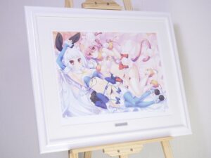 Framed anime art print of two female characters in pastel outfits on a wooden easel.