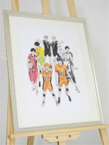 Framed illustration of a volleyball team in orange and black uniforms posing with arms raised on a wooden easel.