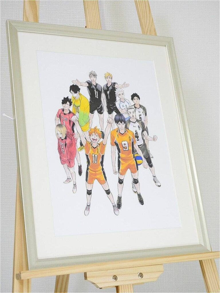 Framed illustration of a volleyball team in orange and black uniforms posing with arms raised on a wooden easel.