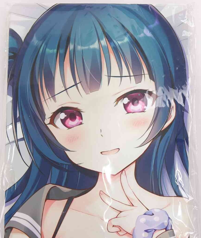 Anime-style girl with blue hair and pink eyes, smiling softly and touching her lips with a finger.