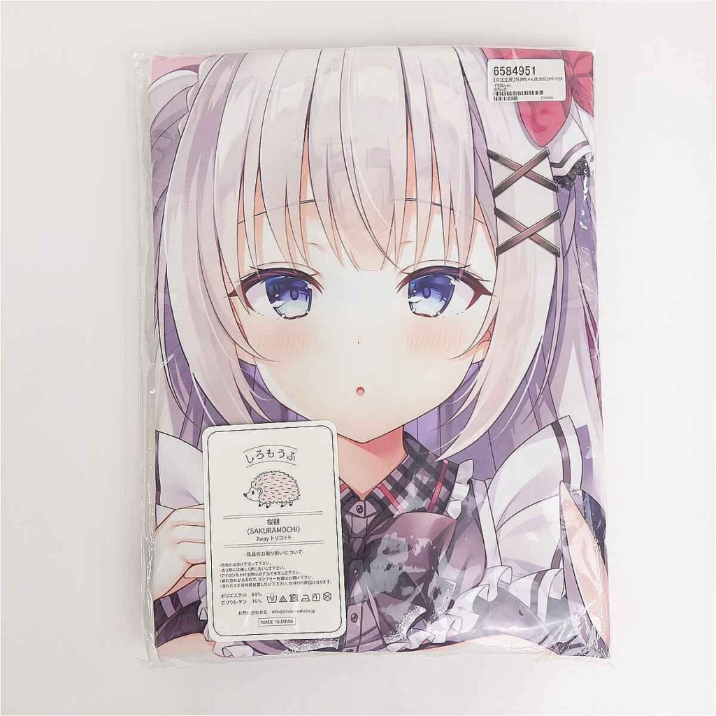 Package of an anime pillow cover featuring a girl with light silver hair and purple eyes, in plastic wrap with a care label visible at the top-right.