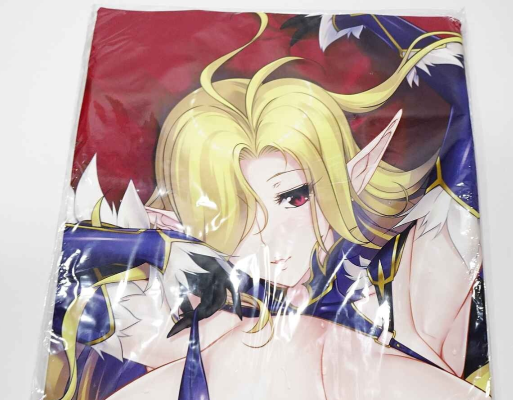 Packaged anime tapestry featuring a blonde-haired elf girl in blue-gold armor, with pointed ears and red eyes.